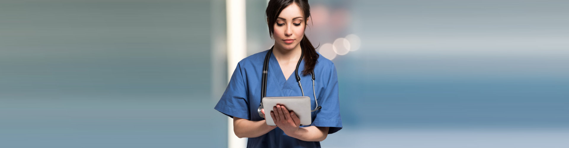 a nurse holding a tablet